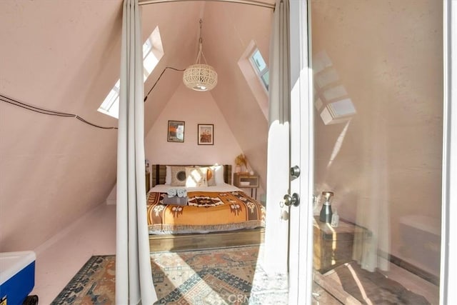 bedroom featuring lofted ceiling