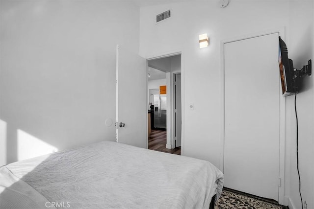 bedroom featuring vaulted ceiling