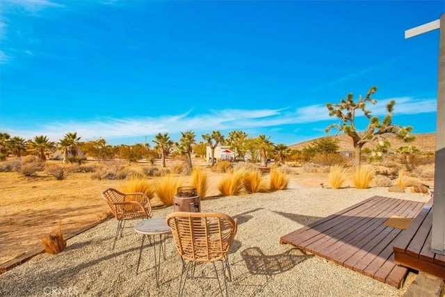 59427 La Crescenta Dr, Yucca Valley, CA 92284 - view of patio / terrace with a wooden deck