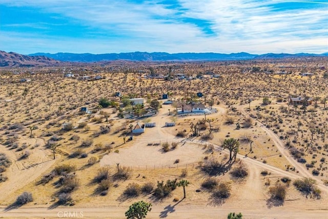 birds eye view of property featuring a mountain view