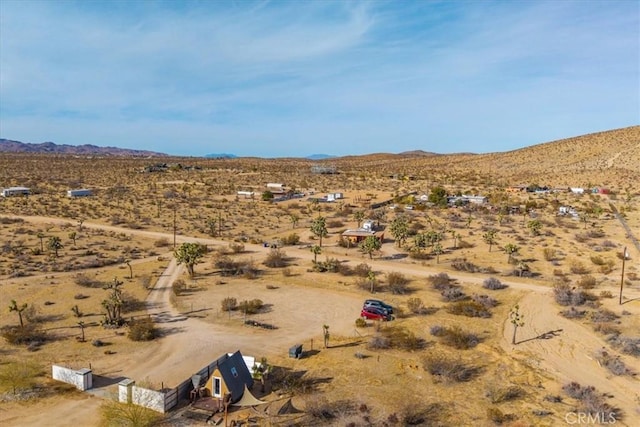 drone / aerial view with a mountain view and a rural view