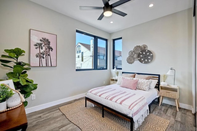 bedroom featuring ceiling fan and hardwood / wood-style floors