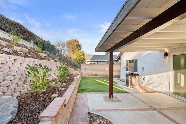 view of yard featuring a patio area and central air condition unit