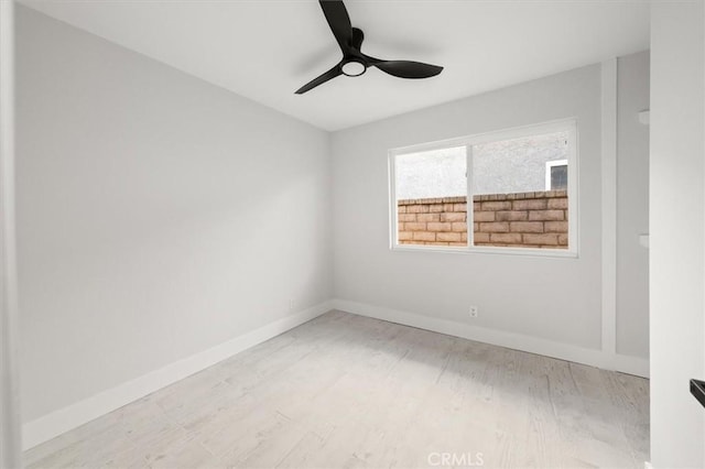 unfurnished room featuring ceiling fan and light wood-type flooring