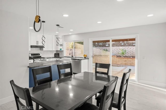 dining space with light wood-type flooring