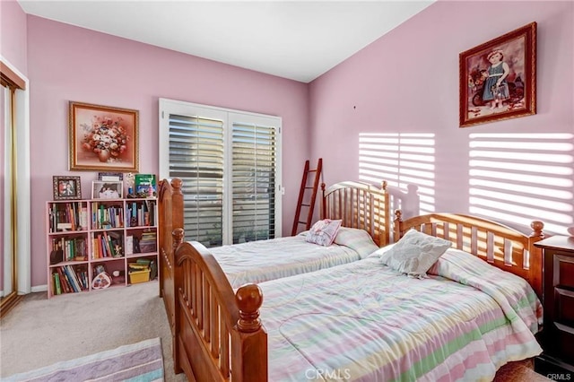 carpeted bedroom with multiple windows