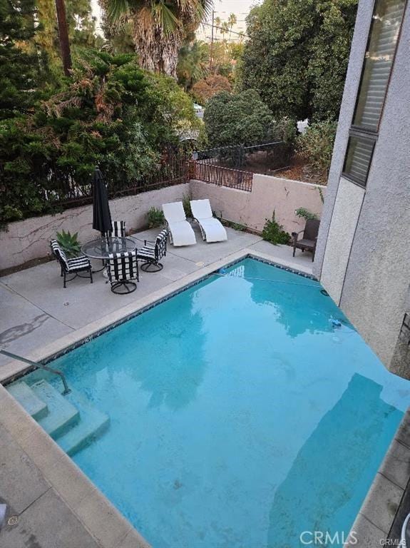 view of pool with a patio area