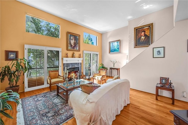 14326 Chandler Blvd Unit 5, Sherman Oaks, CA 91401 - living room featuring wood finished floors, a wealth of natural light, and a fireplace
