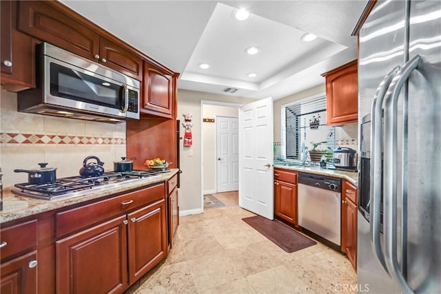 14326 Chandler Blvd Unit 5, Sherman Oaks, CA 91401 - kitchen with stainless steel appliances, a tray ceiling, recessed lighting, and decorative backsplash