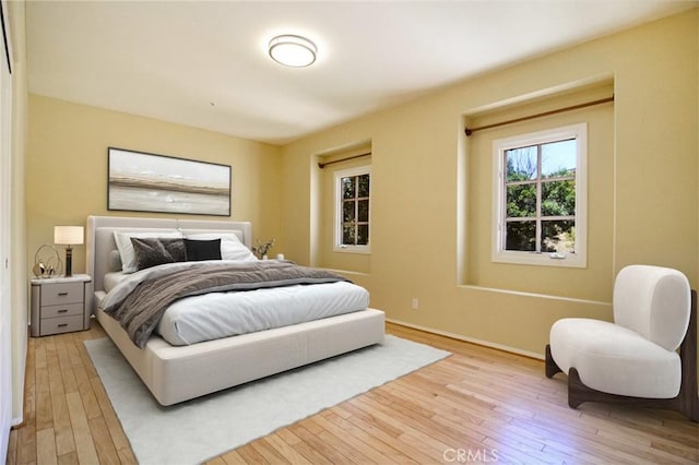 bedroom with light wood-type flooring