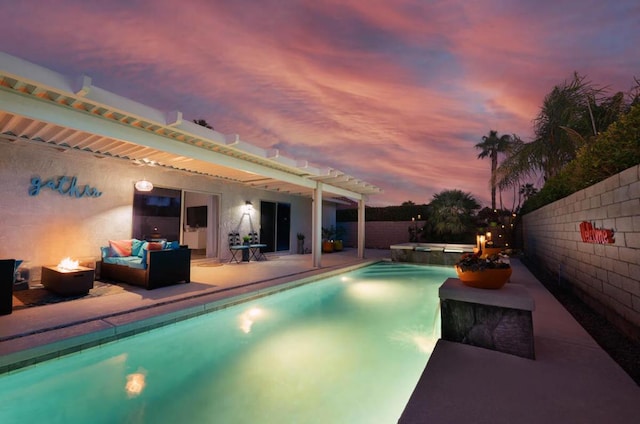 view of pool with outdoor lounge area, an in ground hot tub, and a patio