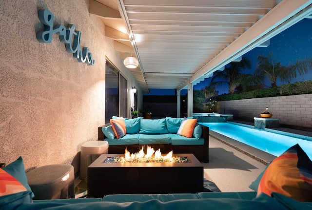 view of swimming pool with a patio area, an outdoor living space with a fire pit, and an in ground hot tub