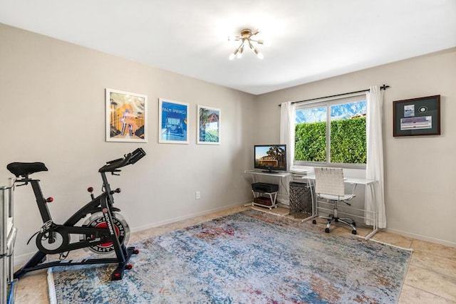 office space featuring light tile patterned floors and a notable chandelier