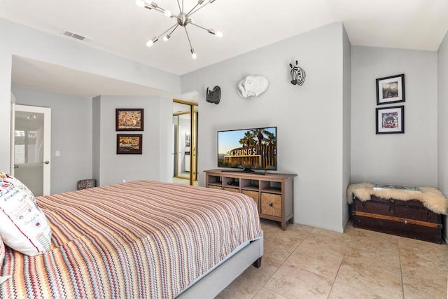 bedroom featuring lofted ceiling, a chandelier, and light tile patterned flooring