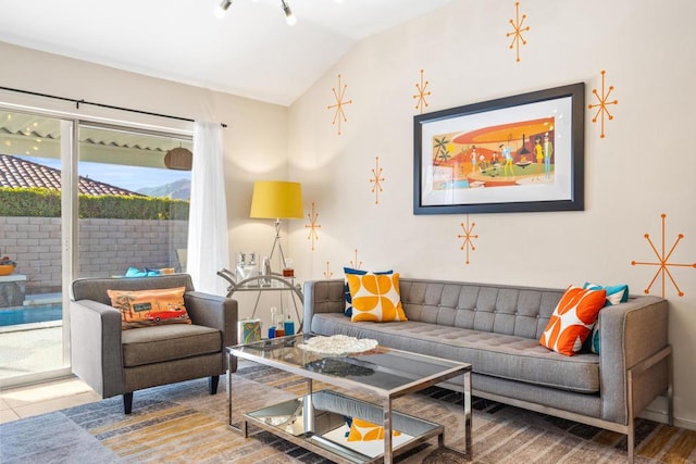 living room featuring lofted ceiling