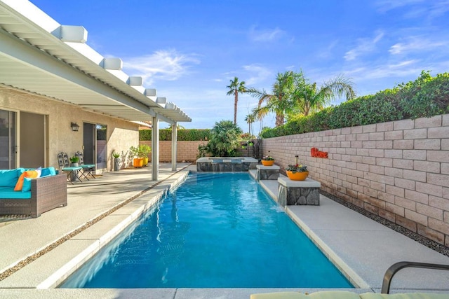 view of swimming pool featuring pool water feature and a patio area