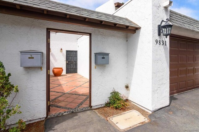 property entrance featuring a garage