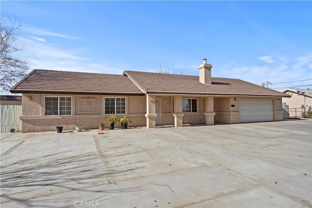 single story home with a garage