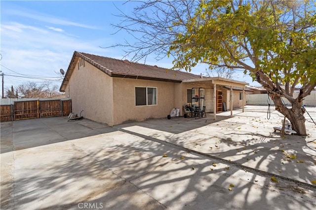 back of house featuring a patio