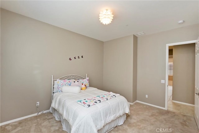 bedroom with light colored carpet