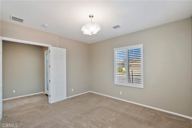 view of carpeted spare room