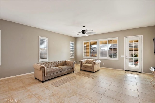 tiled living room featuring ceiling fan