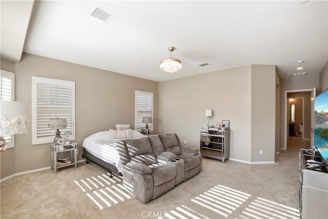 bedroom featuring light colored carpet