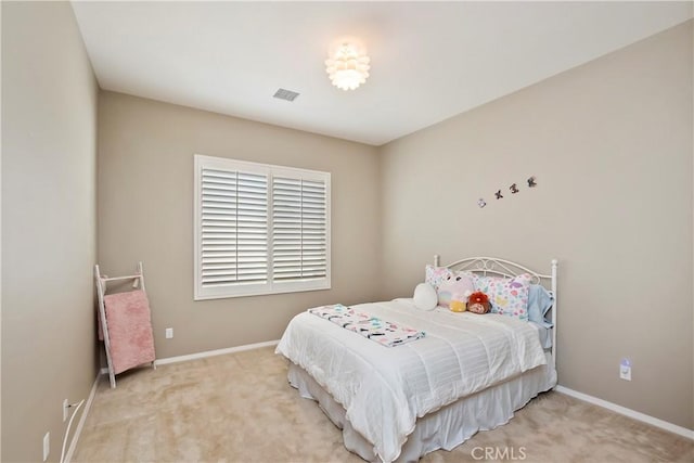 bedroom featuring light carpet