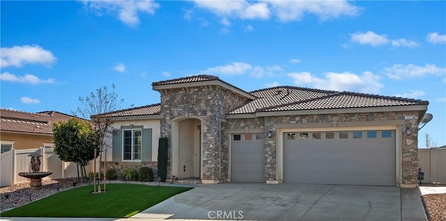 mediterranean / spanish home featuring a garage