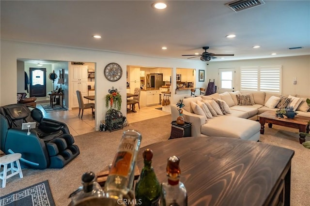 tiled living room with ceiling fan