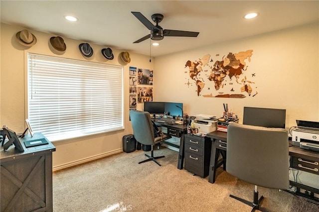 office space featuring ceiling fan and light carpet