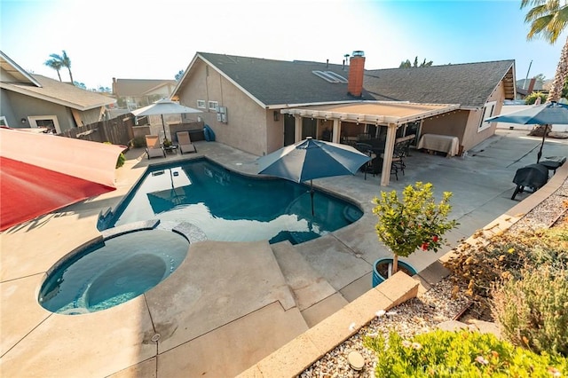 view of swimming pool featuring a patio area and an in ground hot tub