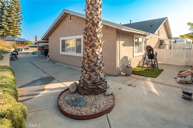 rear view of property featuring a patio