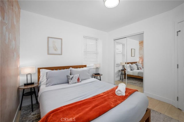 bedroom featuring a closet and hardwood / wood-style flooring