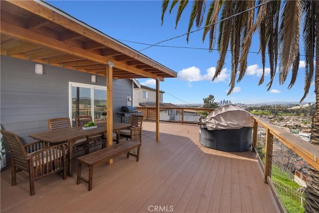 wooden terrace with a grill