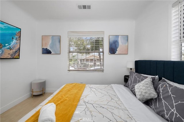 bedroom with wood-type flooring