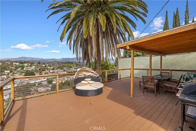 wooden terrace with a mountain view