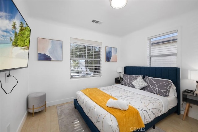 bedroom with hardwood / wood-style floors