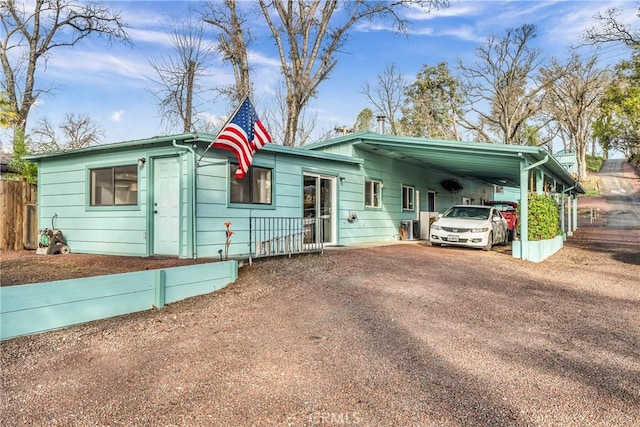 ranch-style house with a carport