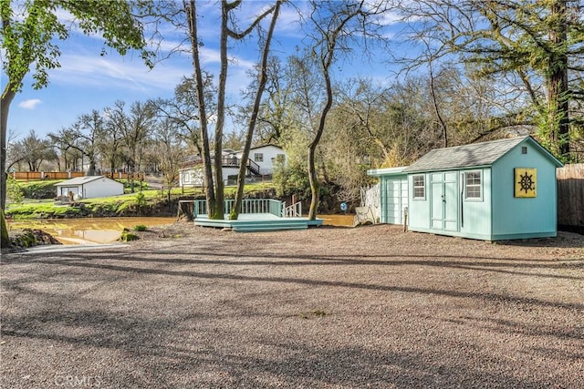 view of yard with an outbuilding and a deck