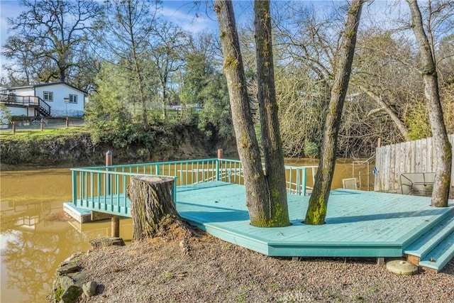 exterior space with a deck with water view