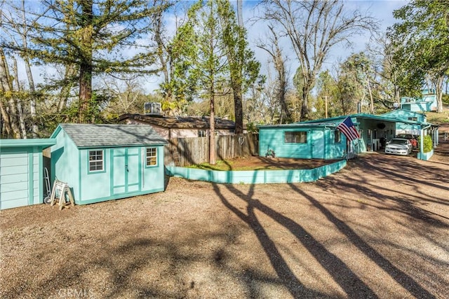 view of outbuilding with a carport