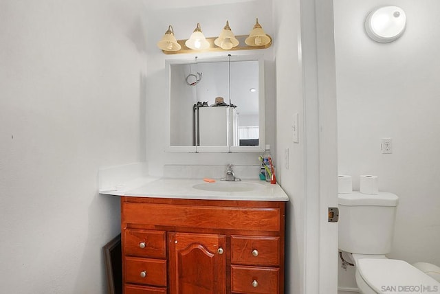 bathroom featuring toilet and vanity