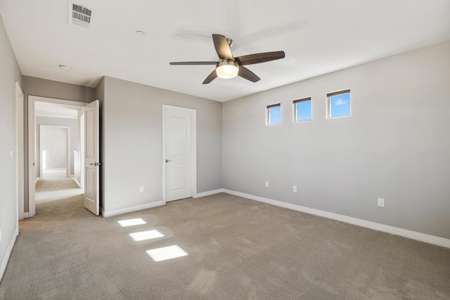 unfurnished bedroom featuring light colored carpet and ceiling fan