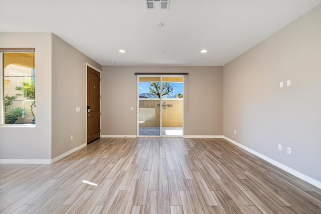 empty room with light wood-type flooring