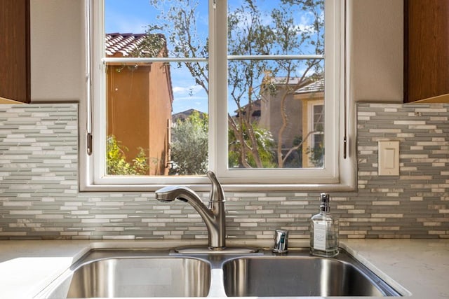 details with sink and decorative backsplash