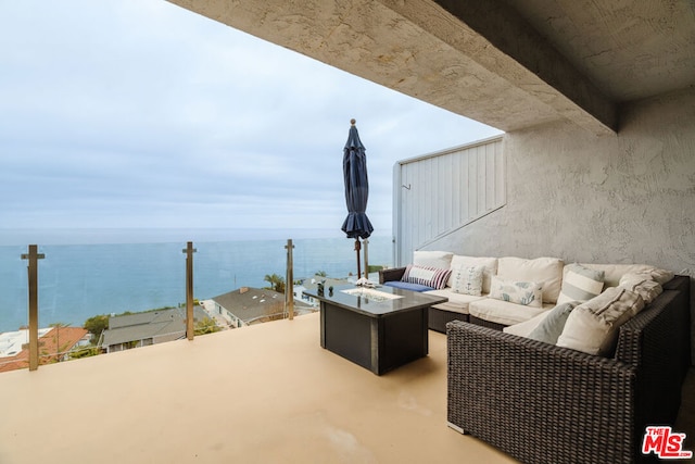 view of patio with a water view and an outdoor hangout area