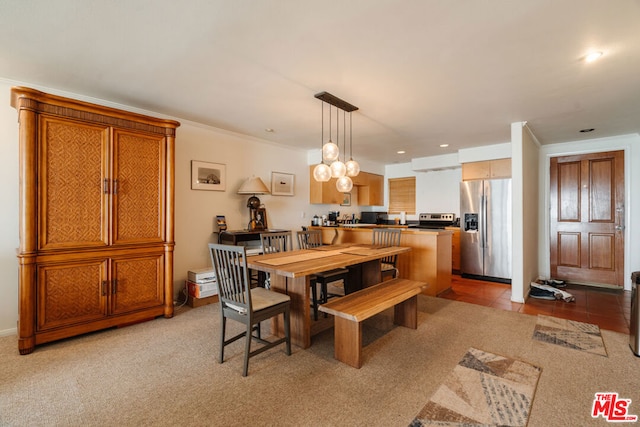 carpeted dining room featuring crown molding and an inviting chandelier