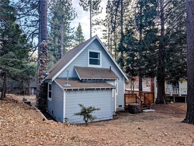 view of side of property with a deck