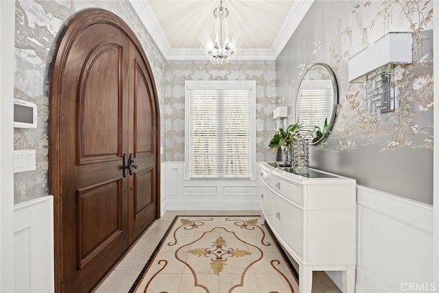 foyer entrance featuring an inviting chandelier and plenty of natural light